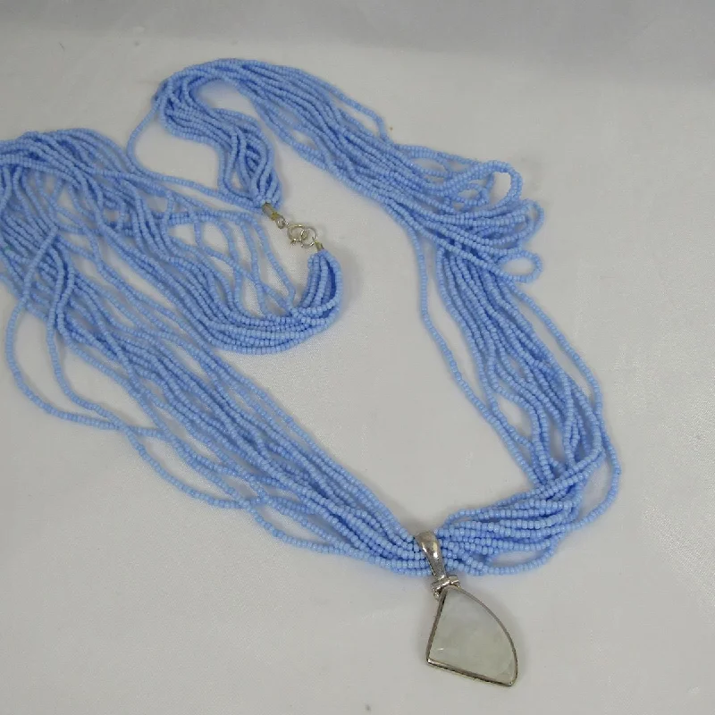 Rainbow Moonstone Pendant on  Blue Multi-strand Necklace